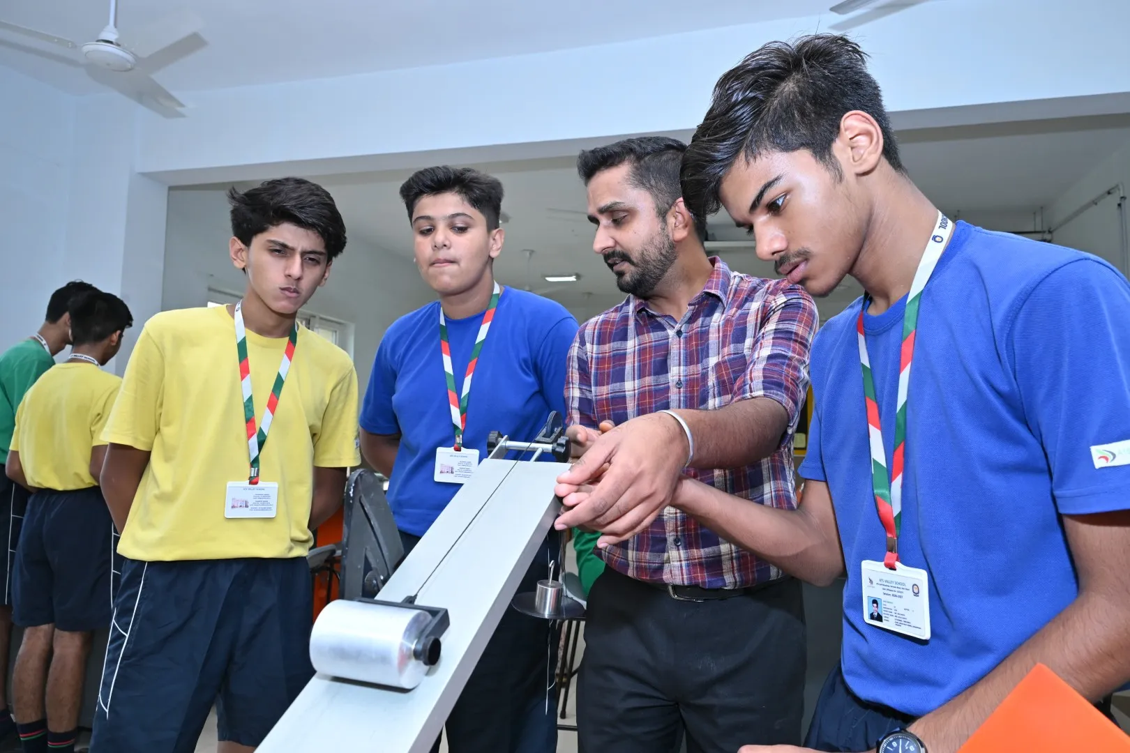 Students working with robotics and technology at ATS Valley School