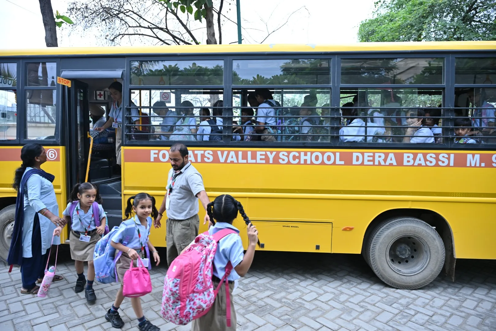 Students using school transport at ATS Valley School