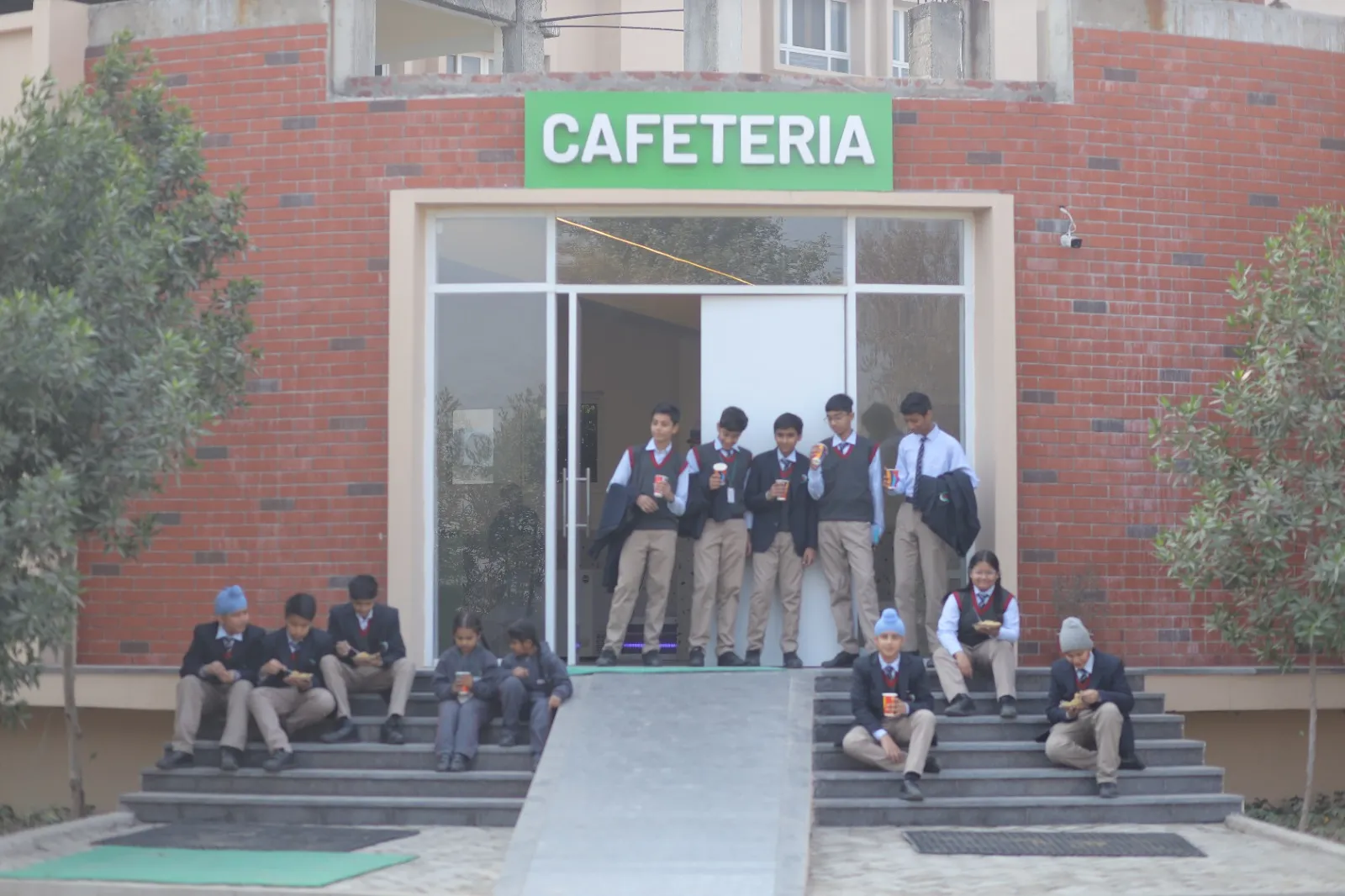 Students in a school dining and activity area